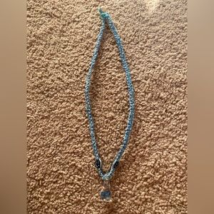 Mushroom pendant necklace.